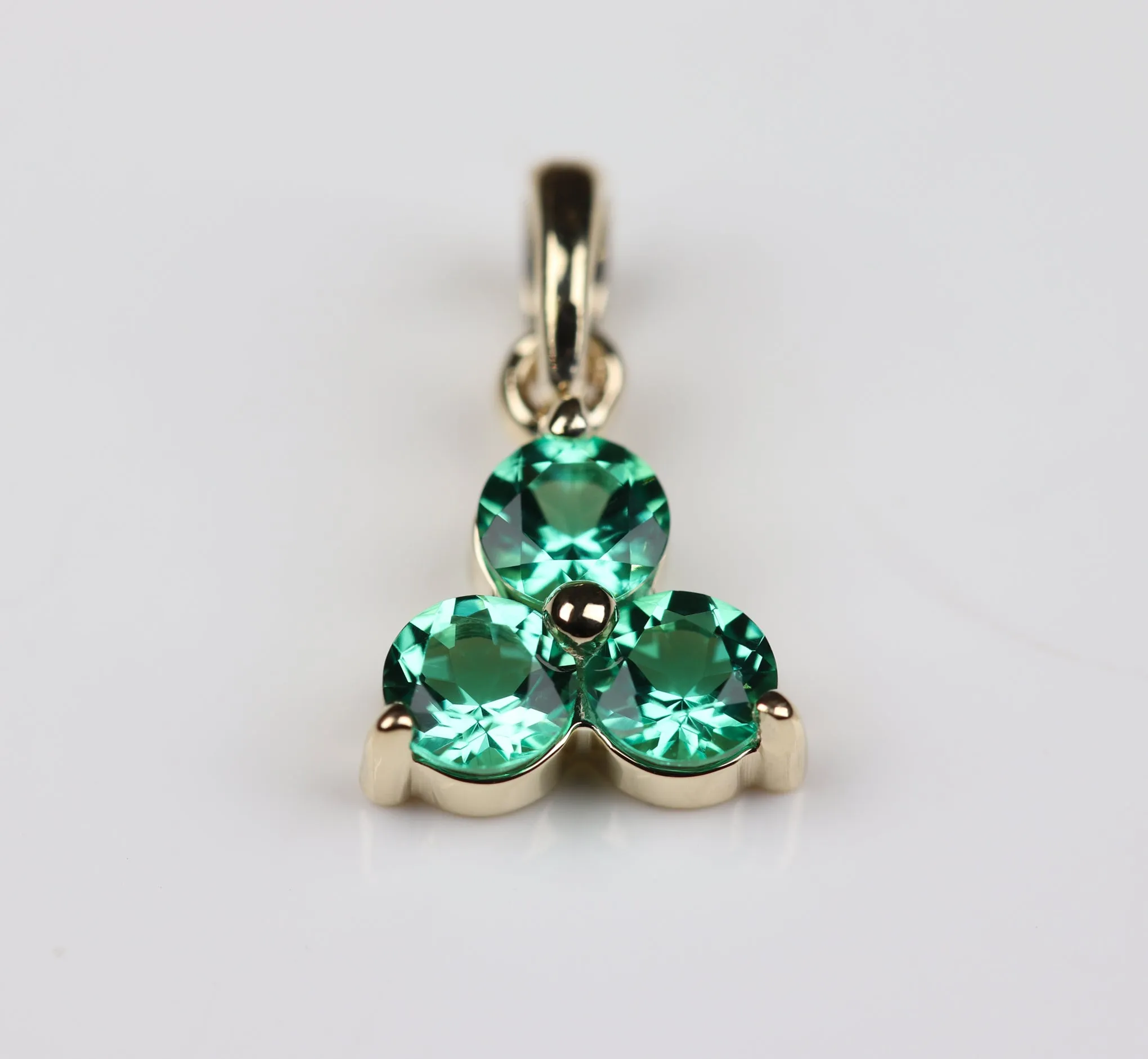 . Emerald Three Stone Charm