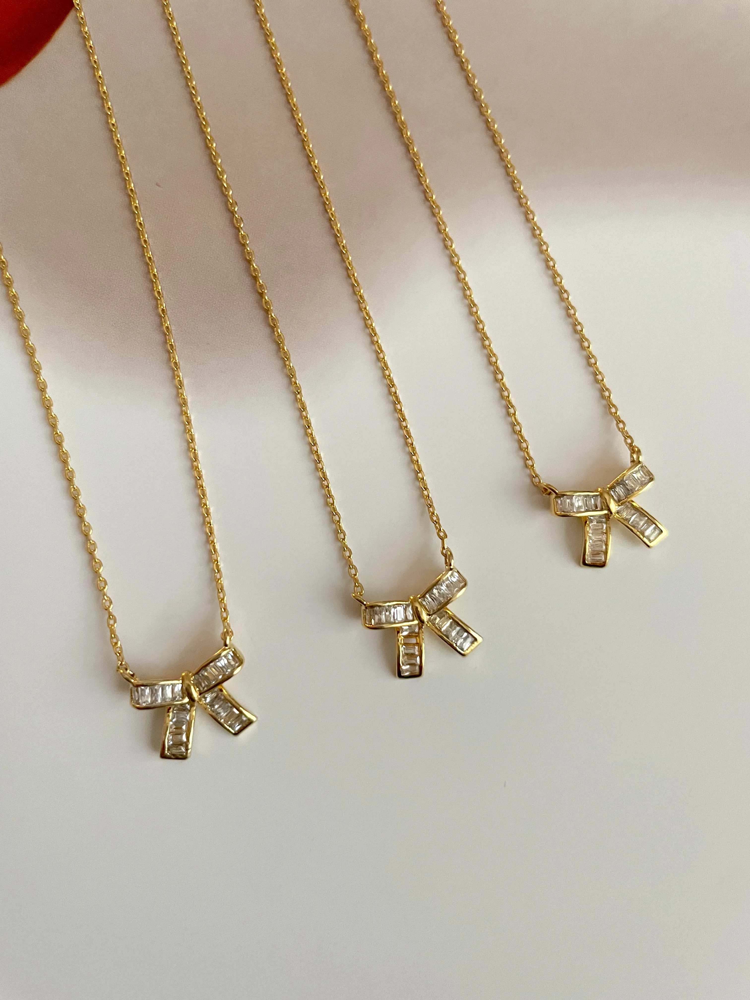 Mini baguette bow necklace