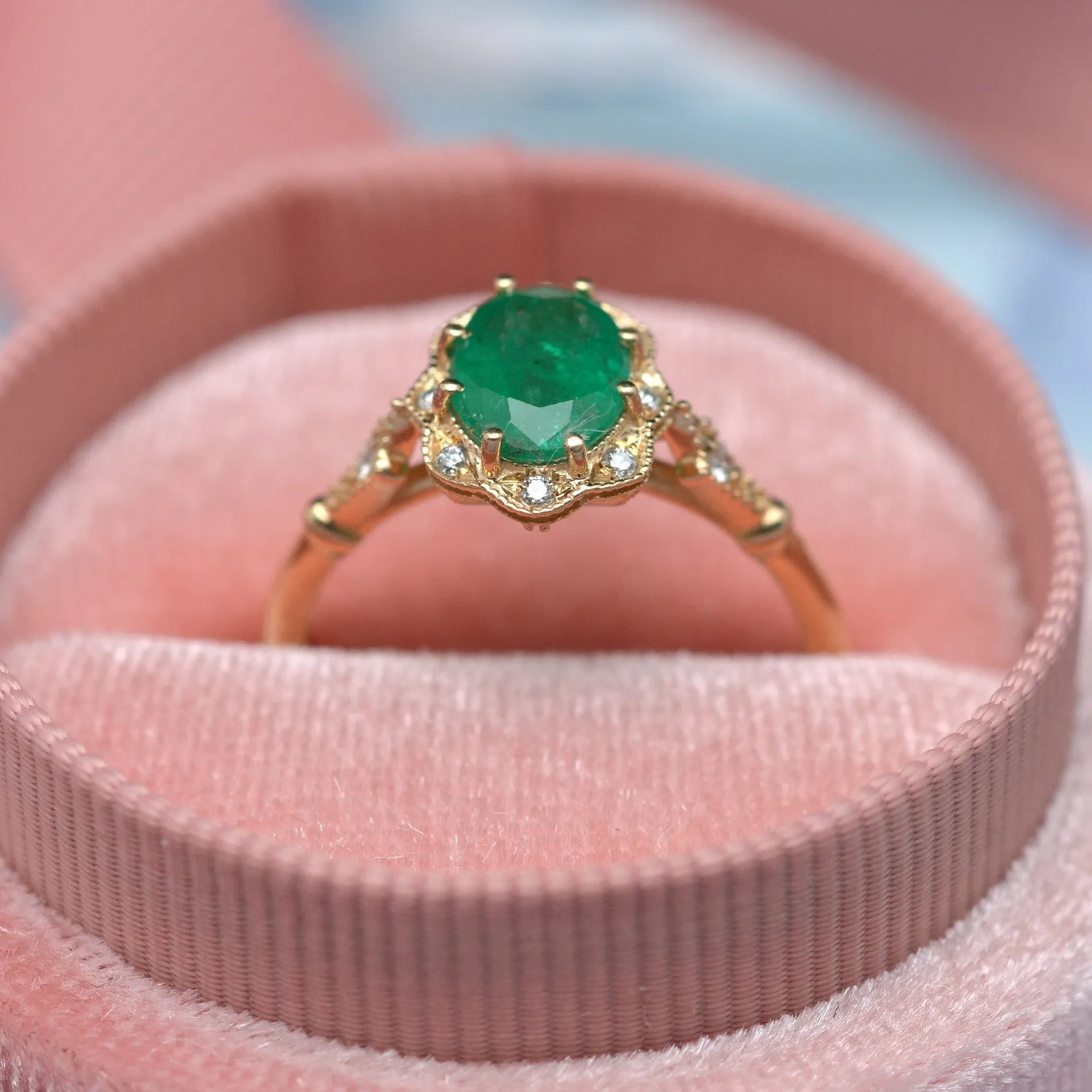 Natural Green Zambian Emerald in a Daisy Oval engagement ring