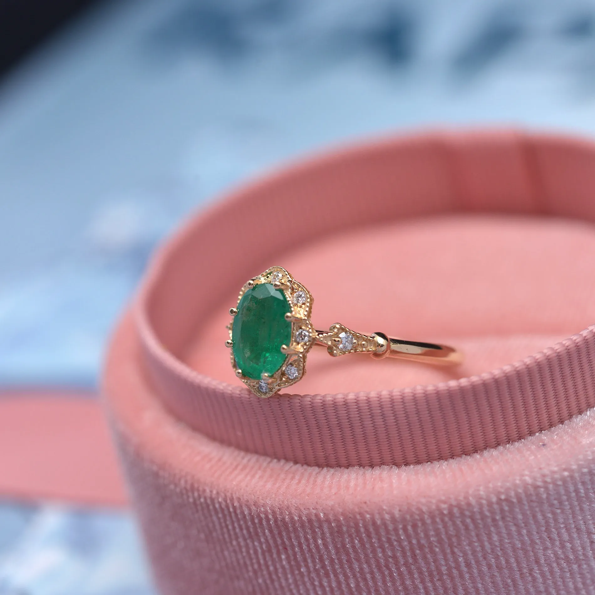 Natural Green Zambian Emerald in a Daisy Oval engagement ring